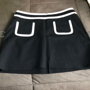 Black and white mini skirt. Material is rayon, nylon and spandex